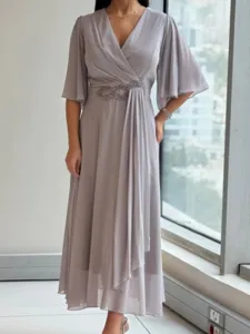Elegant V-neck pleated maxi dress with chic flutter sleeves and rhinestone waist detail.