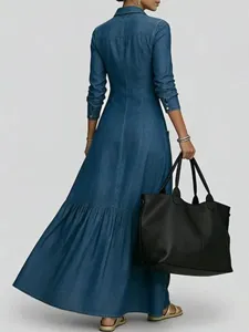 Back view detail of a chic long sleeve denim shirt dress paired with a large black tote.