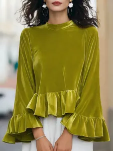 Green velvet long sleeve top with ruffle hem and cuffs, elegant mock neck casual detail view.
