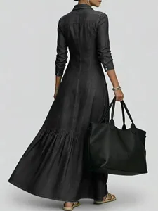 Women's vintage long sleeve denim maxi dress with waist cinching and flare hem detail.