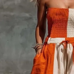 Orange and off white strapless color block cotton linen jumpsuit detail view showcasing fabric.