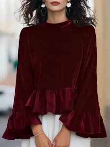 Detail view of women velvet long sleeve ruffle blouse in deep red color, premium fabric texture.