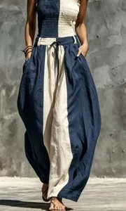 Detail view of contrast color strapless jumpsuit showcasing textured fabric and pocket design.