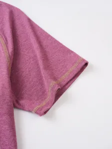 Close-up detail view of short sleeve cuff showing neat contrast stitching on soft fabric.