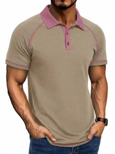 Khaki and pink contrast polo shirt detail view, casual short sleeve men's apparel style.