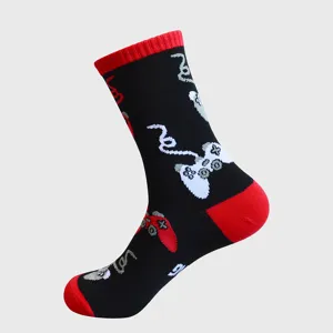 Black cotton mid-tube socks with red heels and retro game controller jacquard.