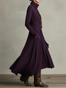 Detail shot of the solid purple long sleeve turtleneck maxi dress with practical side pockets.