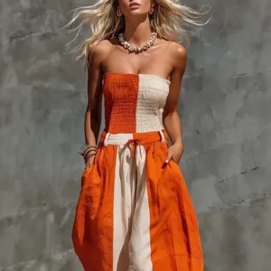 Trendy strapless colorblock cotton linen jumpsuit featuring orange and off-white contrast.