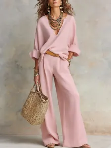 Pink loose resort set detail, V-neck casual blouse and wide-leg trousers for women.
