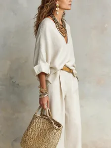 Casual linen loose resort outfit set featuring v-neck top and trousers for women detail view.