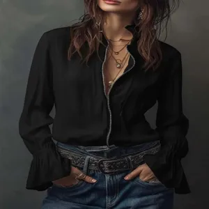 Close-up detail of the black women's long sleeve zipper blouse showing flared cuffs.