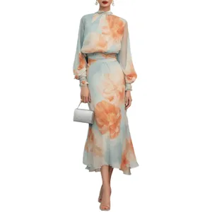 Elegant light blue floral chiffon maxi dress with high neck and bubble sleeves.