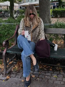 Leopard print short coat detail showing stylish autumn winter fashion design and warm fabric.