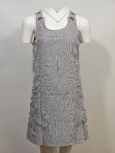 Detailed view of women casual striped sleeveless jumper dress with buttons and front pockets.