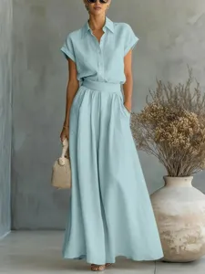 Light blue two-piece linen-style shirt and wide leg trousers set for summer fashion.