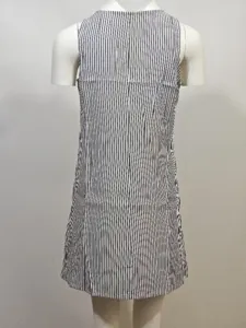 Back view of a casual sleeveless short dress featuring classic black and white vertical stripes.
