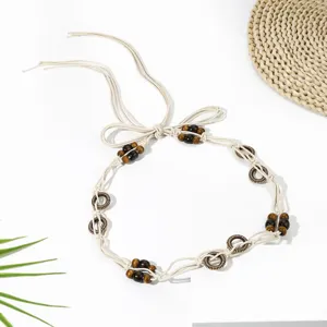 Boho woven waist chain with wooden beads and rings, chic bohemian belt detail for skirts.