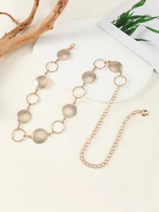 Gold metal disc chain belt detailed view, elegant waist accessory for women and dresses.