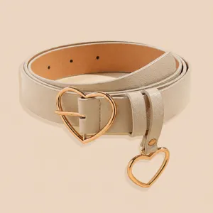 Women minimalist beige leather belt with cute gold heart buckle and dangling pendant.
