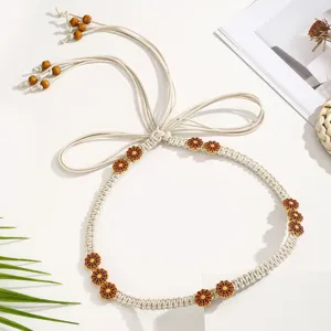 Bohemian woven waist belt for women, ethnic macrame dress accessory with wooden flower beads.