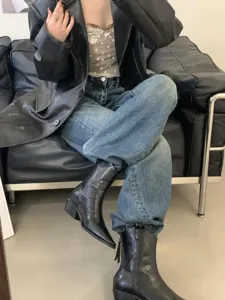 Black pointed toe western ankle boots detail shot, stylish vintage shoes for women