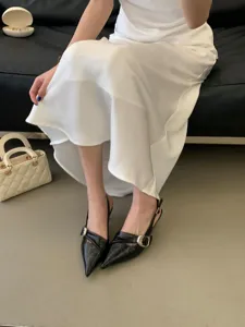 Chic women black pointed toe slingback high heels with stylish metal buckle detail.