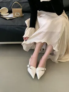 Stylish women's white pointed toe slingback heels with metal buckle detail for daily wear.