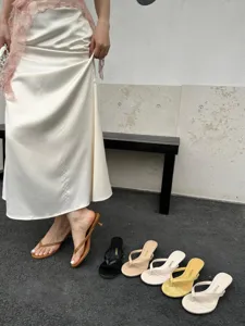 Detail view of summer minimalist thong high heel sandals showcased in multi-color options.