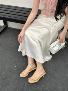 Detail view of stylish summer minimalist thong kitten heel sandals for women, elegant daily wear.