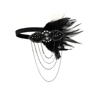 1920s vintage black feather flapper headband with rhinestones, pearls and draping chain tassels.