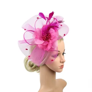 Handmade pink fascinator headband with feathers and mesh flower for bridal party dress events