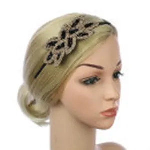 Detailed close-up view of exquisite handmade beaded leaf hair band for evening party wear.