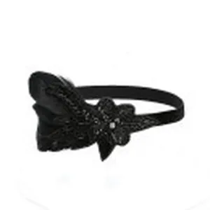 Vintage black feather headband detail, Gatsby style party hair accessory and elegant bridal jewelry.