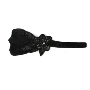 Black feather headband with sequins and rhinestones for party, vintage dance and stage shows.