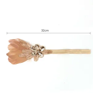 Detailed view of the gold feather sequin headband, showing exquisite decoration and texture.