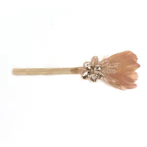 Detailed shot of the 1920s vintage flapper feather headband with sparkling sequins and beads.