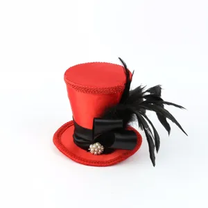 Detailed view of red mini top hat with black bow, feather and pearl accent for party and prom.