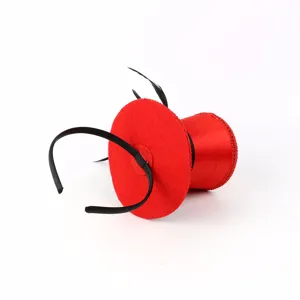 Red mini top hat headband with black feathers for party costume accessory detail view.