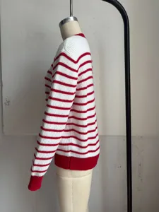 Side view detail of a classic red and white striped crewneck casual knit top for women.
