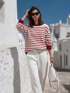 Casual red and white striped knit sweater with contrast cuffs and round neck for women.