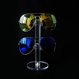 Clear acrylic 2-tier sunglasses display stand detail view, perfect for retail store counter organization.