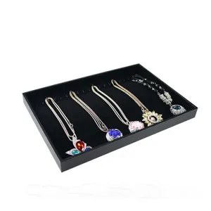 Fashion crystal pendant necklaces set displayed on a black velvet jewelry tray for showcase.
