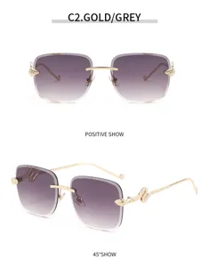 Lunettes de soleil sans monture carrées dégradées avec branches tête de serpent dorées élégantes.