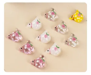 Handcrafted glass bird beads with polka dots and rose decor for DIY jewelry making.