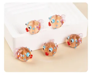 Glass pufferfish bead detail view, cute loose beads for DIY handmade bracelets and necklaces.