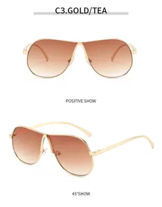Detailansicht modischer goldener Metall-Piloten-Sonnenbrille mit braunen Farbverlaufslinsen.