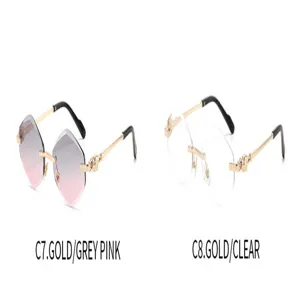 Luxury polygon rimless sunglasses for women with gold ornate temples and gradient lenses.