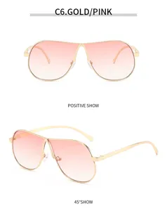 Grosse rosafarbene Sonnenbrille mit Metallrahmen fur Damen im retro Piloten-Stil.