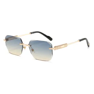 Stylish polygon rimless sunglasses for men and women, gradient lenses with gold metal temples.