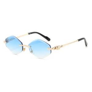 Gradient blue rimless polygonal sunglasses with chic golden frames and detailed temples.